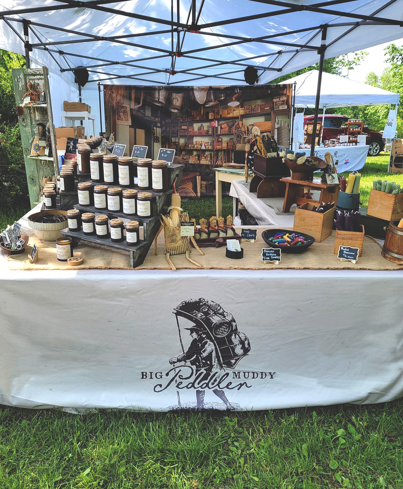 Big Muddy Peddler set up with tent selling products